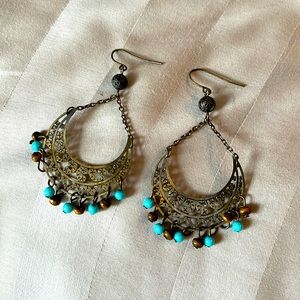 Brown and teal beaded earrings with chrome accents